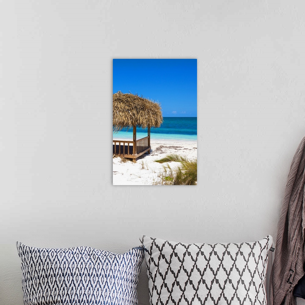 A bohemian room featuring Relaxing photograph of a cabana on the white sands of a Cuban beach with beautiful blue water in ...