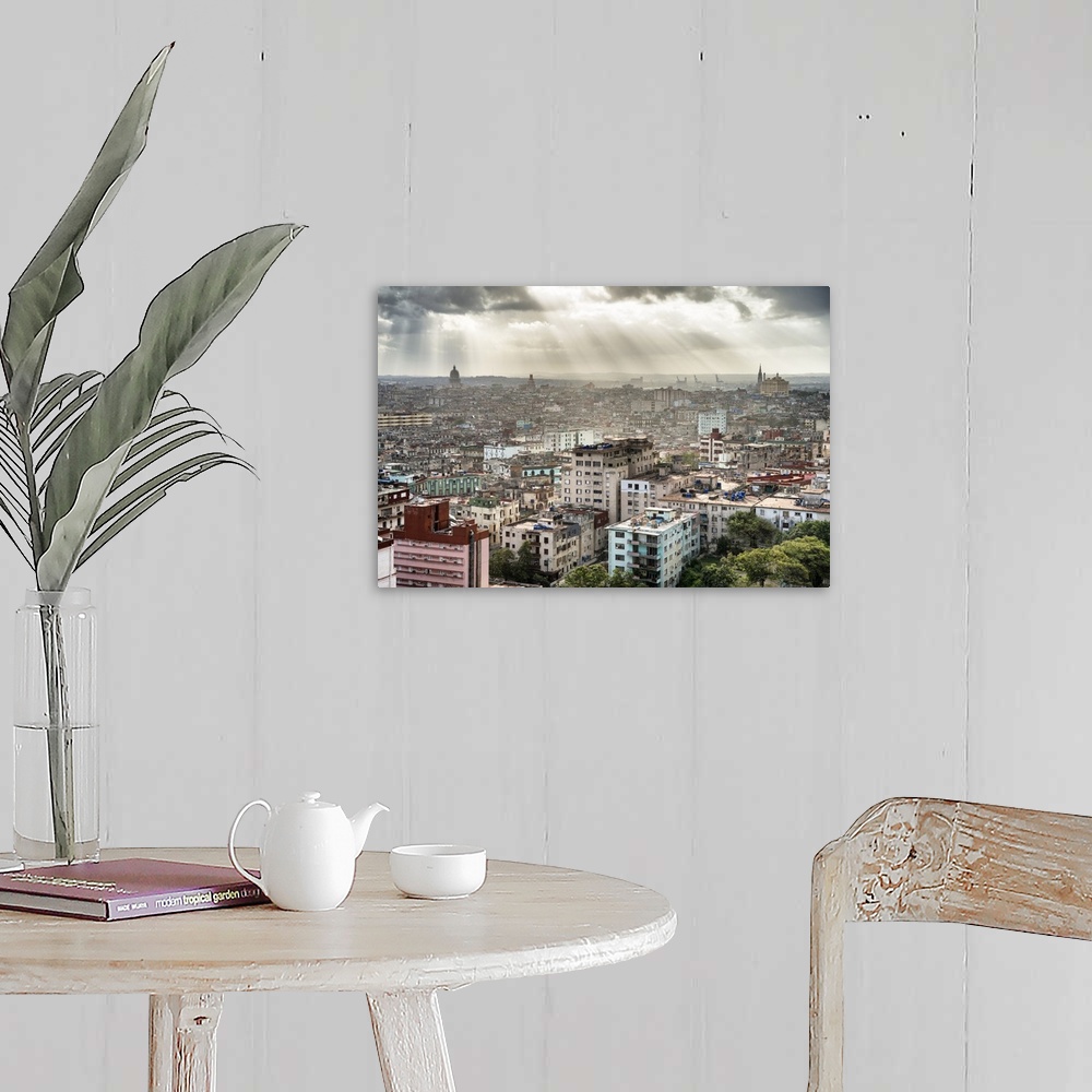 A farmhouse room featuring Beautiful photograph of the sun beaming through the clouds over the city of Havana.