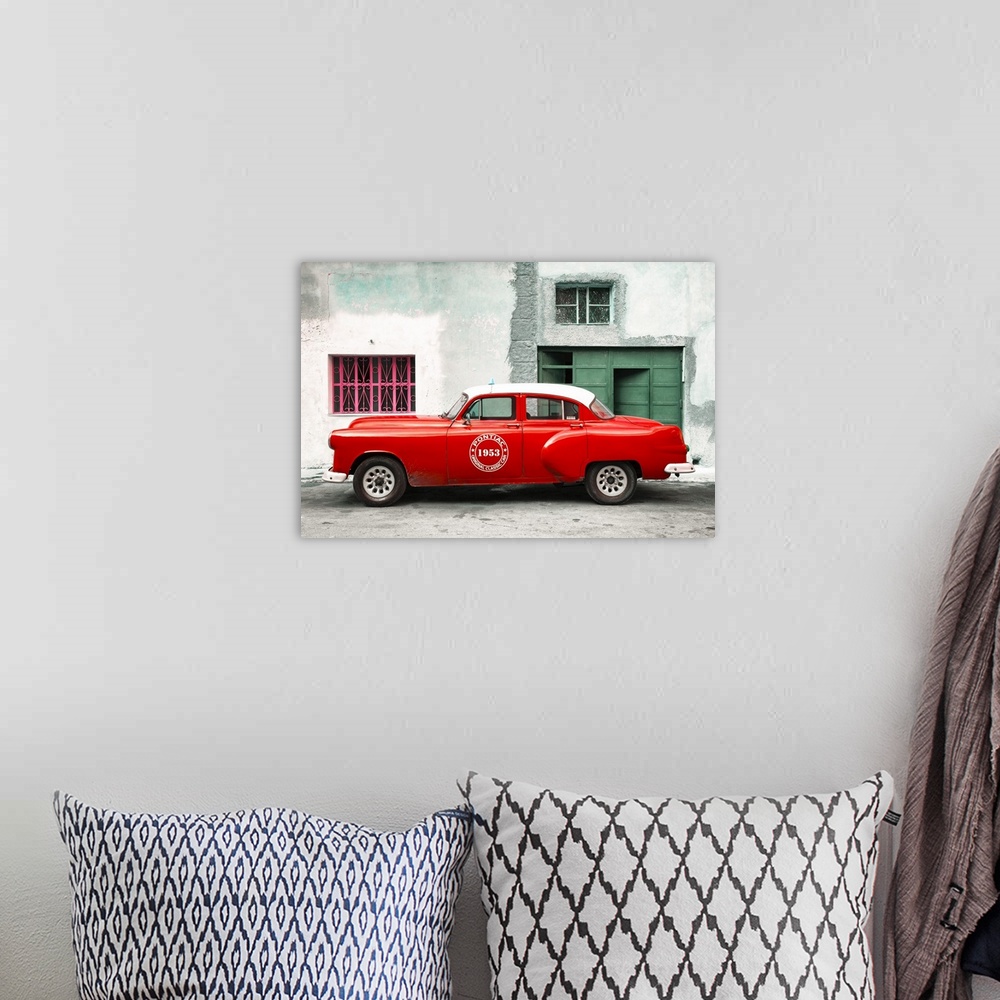 A bohemian room featuring Photograph of a vintage red Pontiac Original Classic Car from 1953 parked on the streets of Havana.