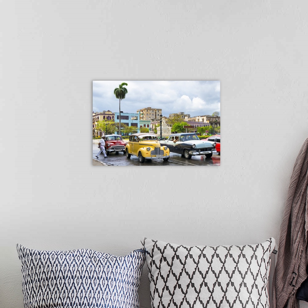 A bohemian room featuring Photograph of a cloudy sky above a wet Havana street scene with vintage cars and taxis.