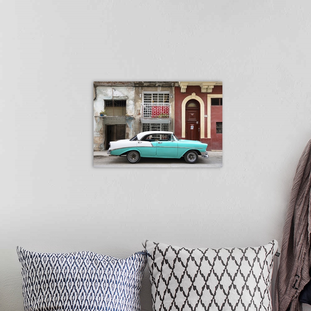 A bohemian room featuring Photograph of a turquoise and white vintage card parked on the side of a street in Havana with we...