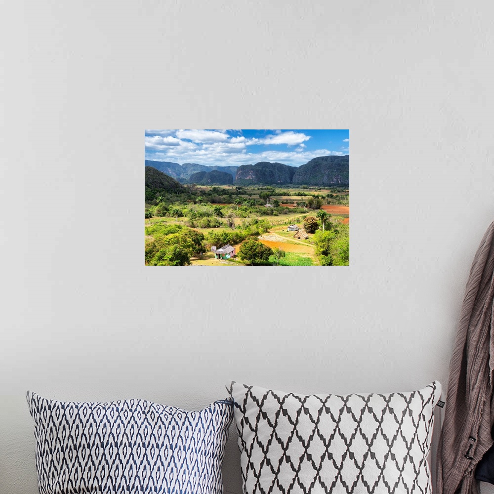A bohemian room featuring Landscape photograph of Vinales Valley in Cuba on a beautiful day.