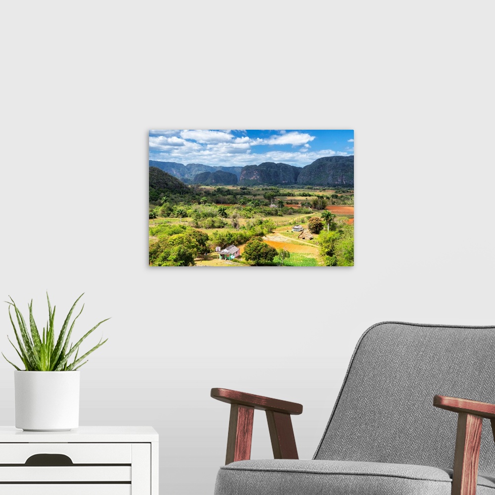 A modern room featuring Landscape photograph of Vinales Valley in Cuba on a beautiful day.