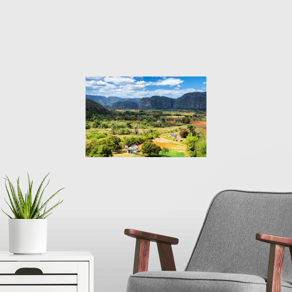 A modern room featuring Landscape photograph of Vinales Valley in Cuba on a beautiful day.