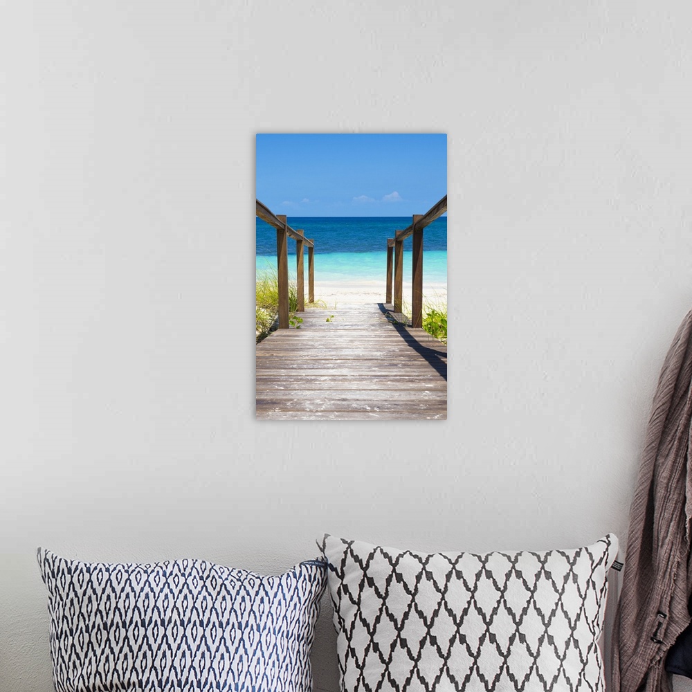 A bohemian room featuring Photograph of a wooden walkway leading onto a beach in Cuba with crystal blue waters.