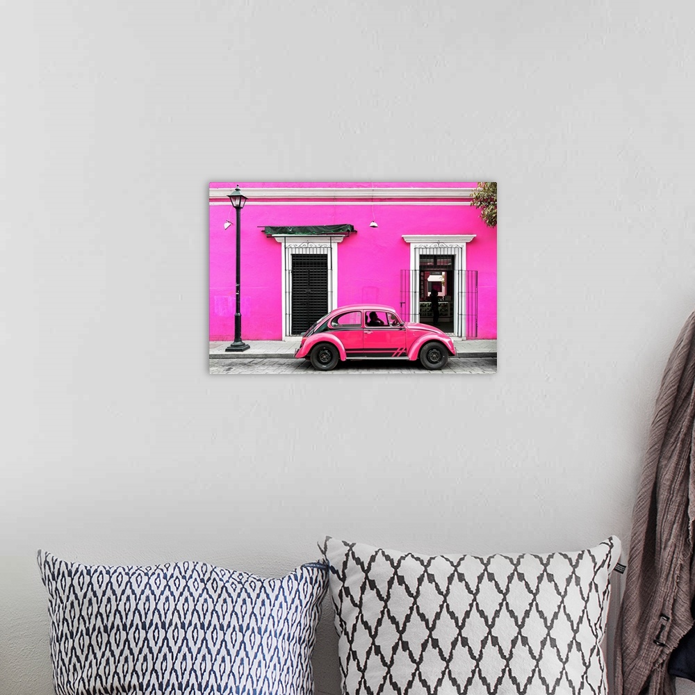 A bohemian room featuring Photograph of a classic pink Volkswagen Beetle in front of a pink building, Mexico. From the Viva...