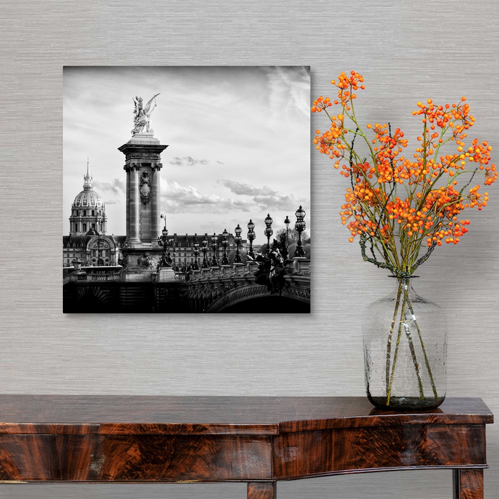 A traditional room featuring Black and white photo of a statue on the Pont Alexandre III in Paris, France.
