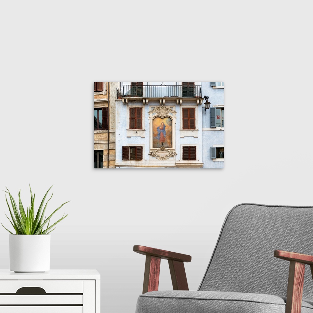 A modern room featuring This is a building facade with a painting of Affresco della Madonna on Piazza della Rotonda in Ro...