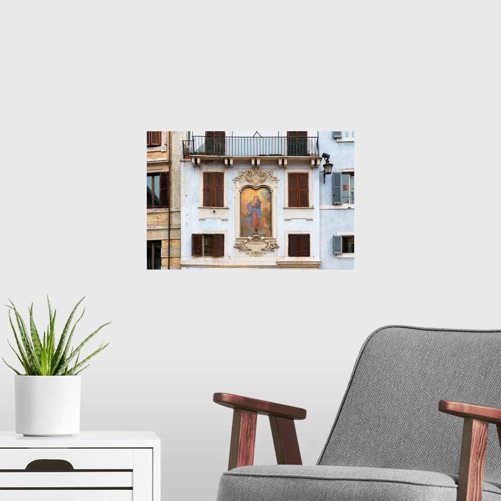 A modern room featuring This is a building facade with a painting of Affresco della Madonna on Piazza della Rotonda in Ro...