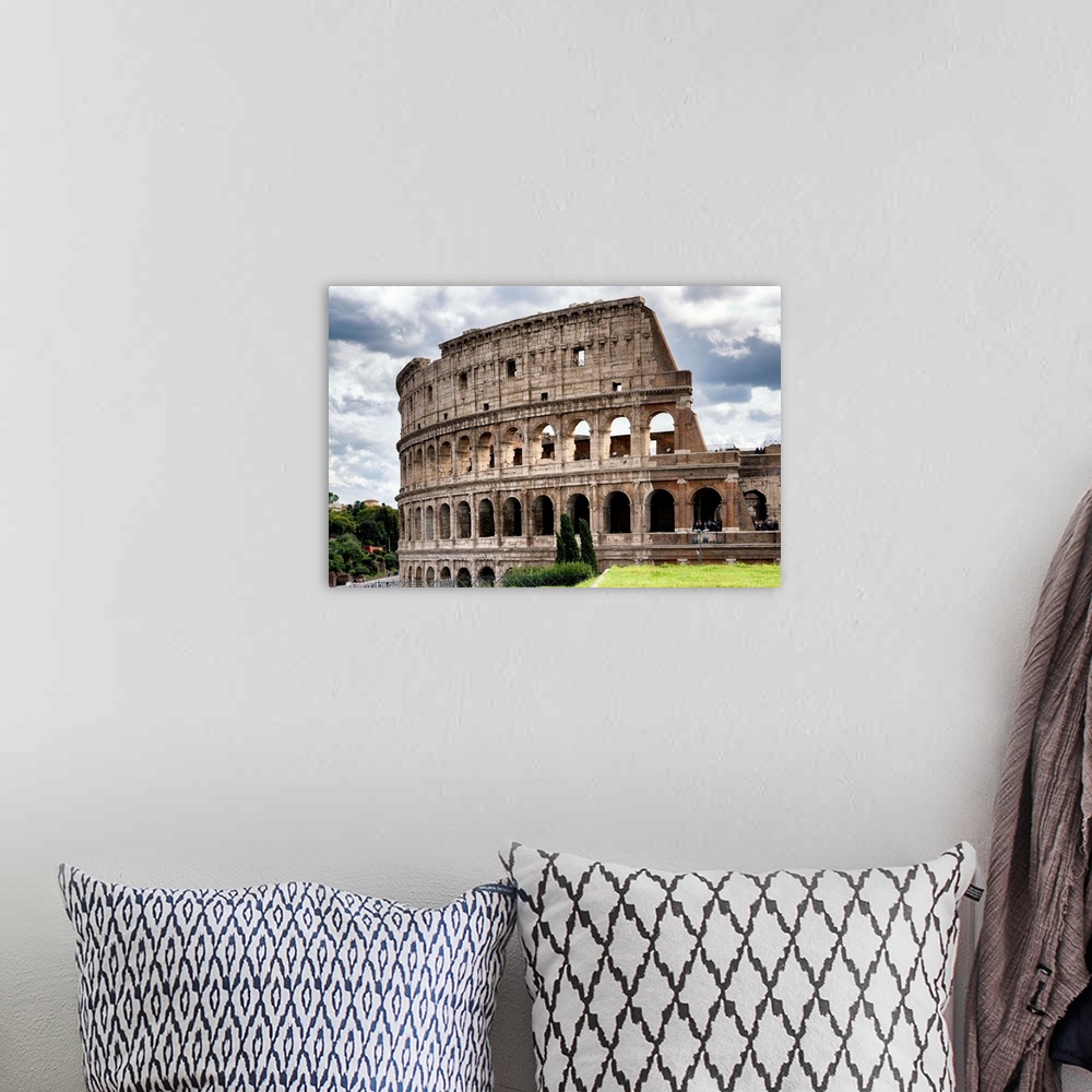 A bohemian room featuring It's a view of the Colosseum in the centre of the city of Rome, Italy.