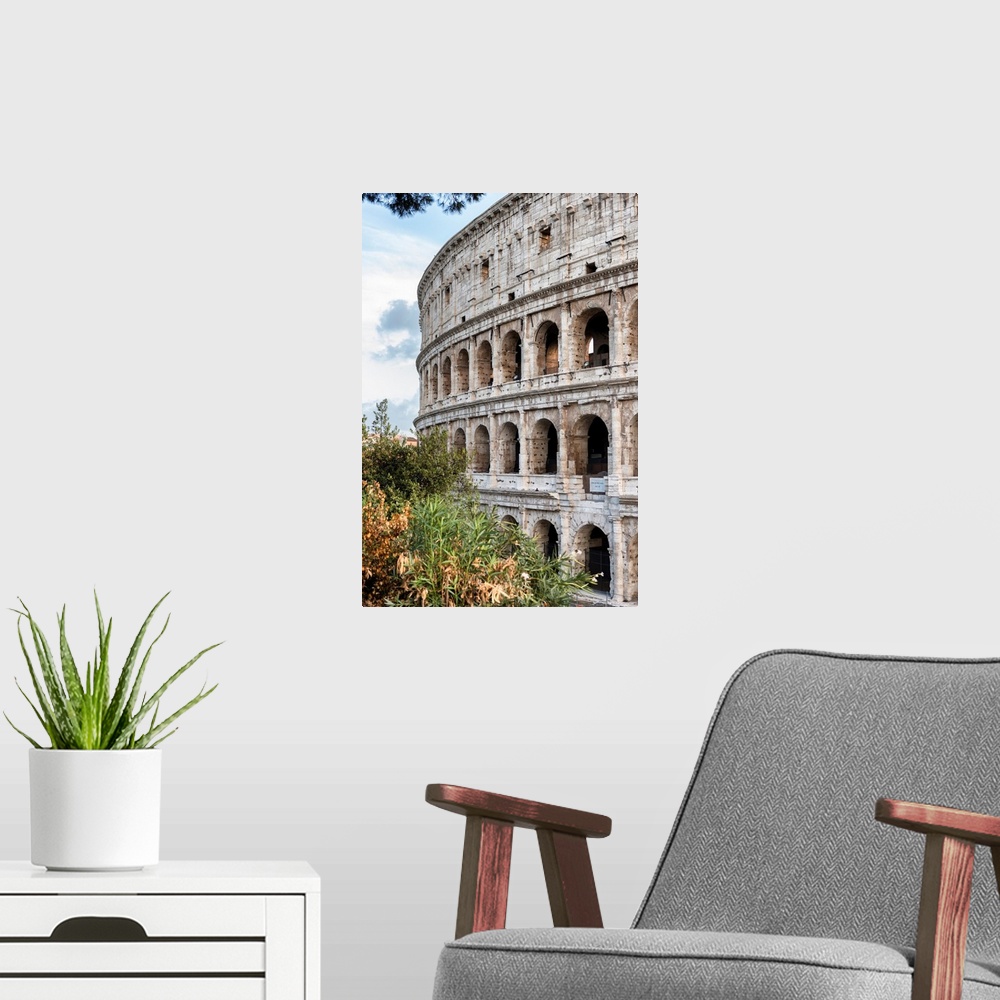 A modern room featuring It's a view of the Colosseum in the centre of the city of Rome, Italy.