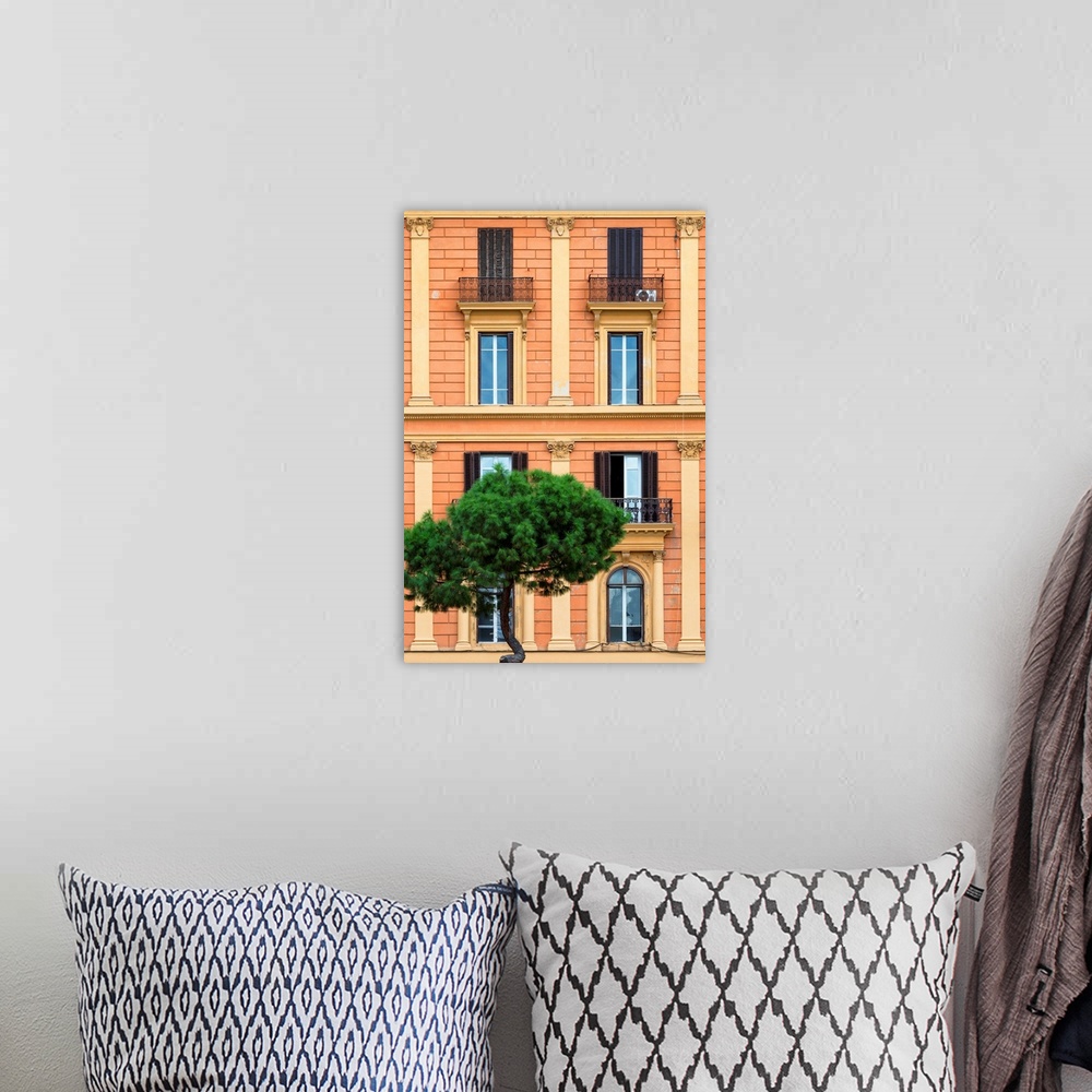 A bohemian room featuring It's a orange facade of a building in the city of Rome in Italy.