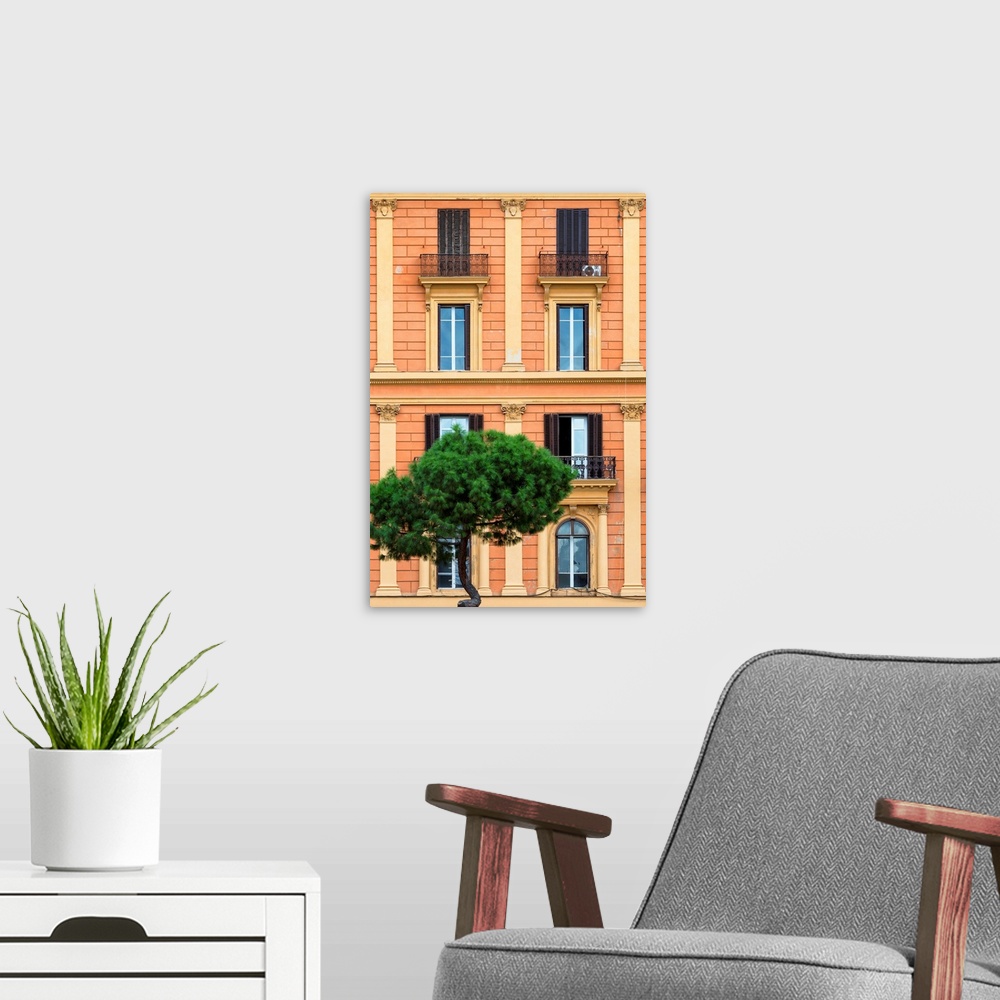A modern room featuring It's a orange facade of a building in the city of Rome in Italy.