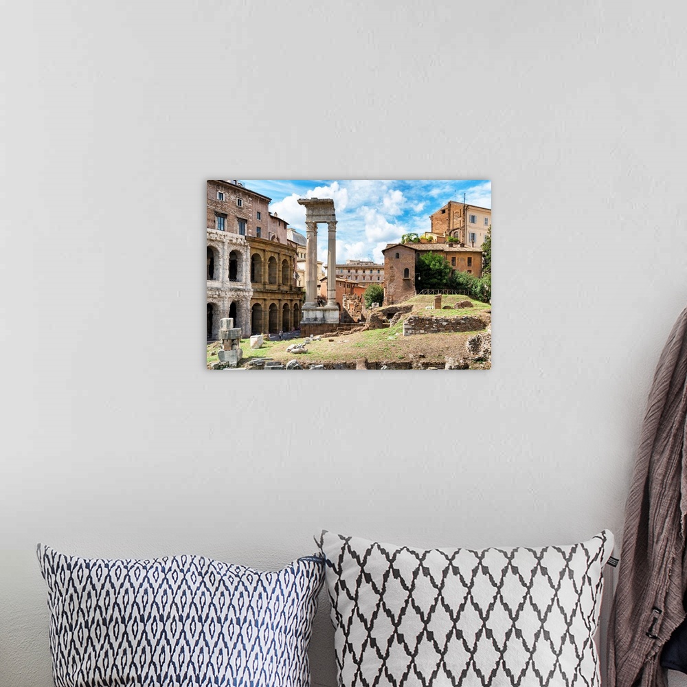 A bohemian room featuring These are ancient roman ruins located in the city center of Rome in Italy.