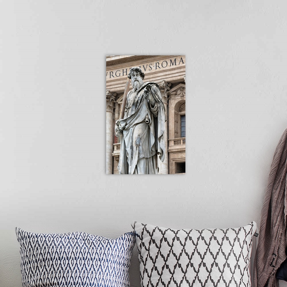 A bohemian room featuring It's a roman sculpture on the exterior of St. Peter's Basilica located in Vatican City.