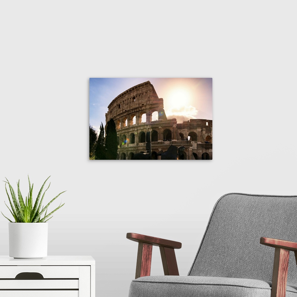 A modern room featuring It's a view of the Colosseum at sunset in the centre of the city of Rome, Italy.