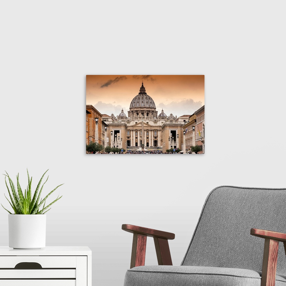 A modern room featuring It's St Peter's Basilica and St Paul's Cathedral at sunset in the Vatican City State.