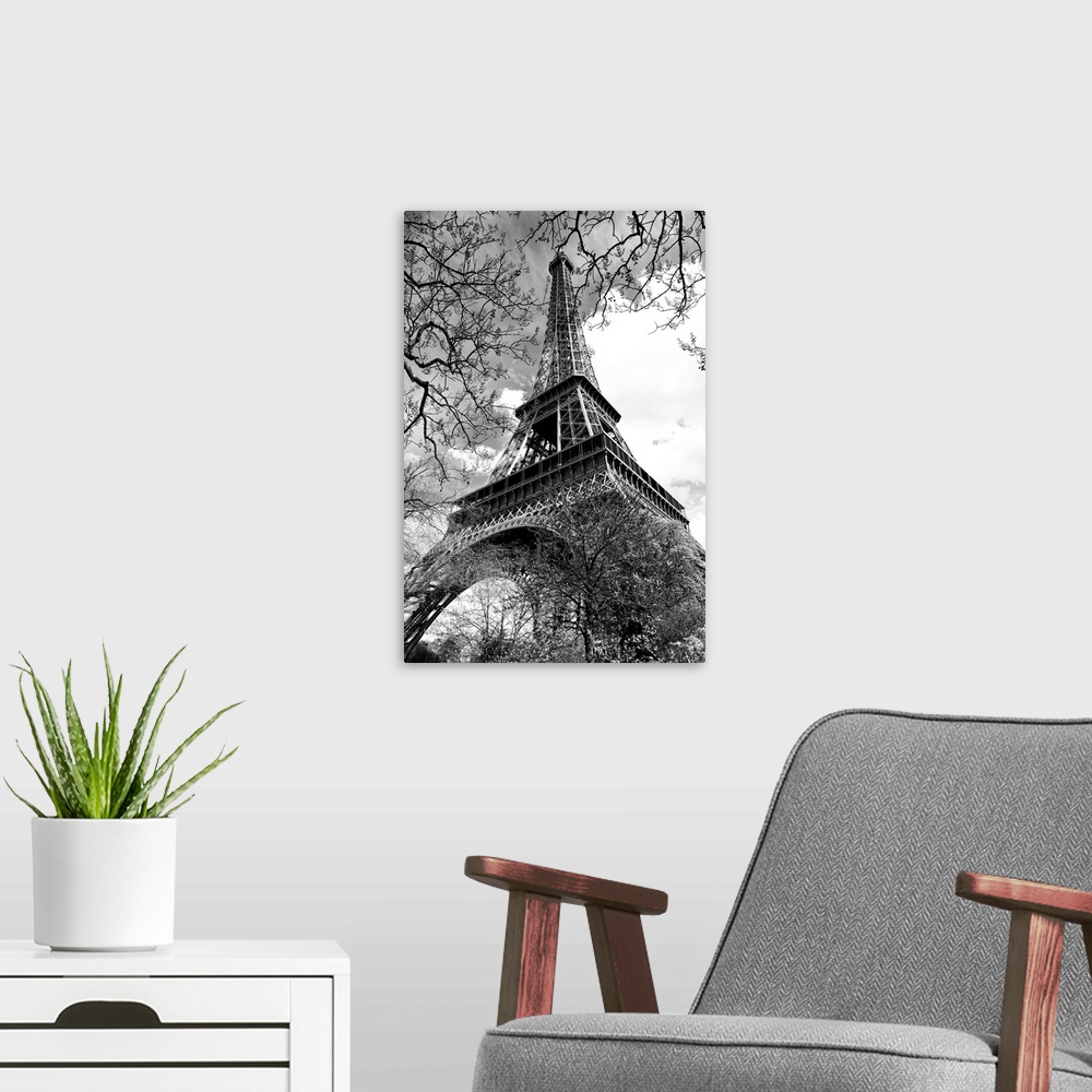 A modern room featuring Fine art photograph of the Eiffel Tower in France, looking up from the ground.