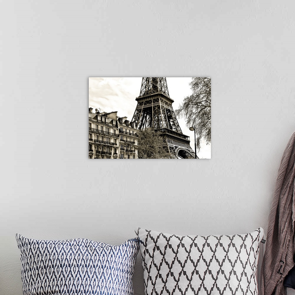 A bohemian room featuring Fine art photograph of the Eiffel Tower in France, with trees and buildings in the foreground.