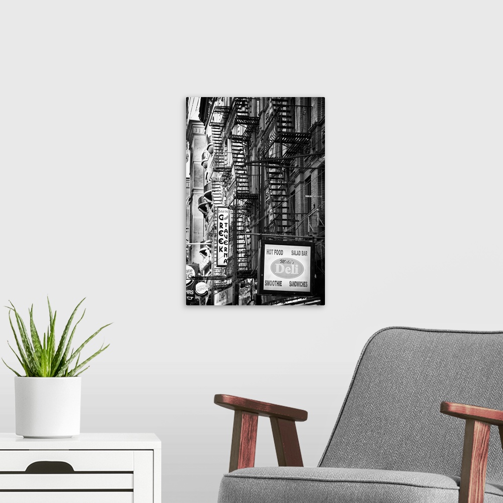 A modern room featuring Black and white photo of several fire escapes on the sides of buildings in Manhattan.