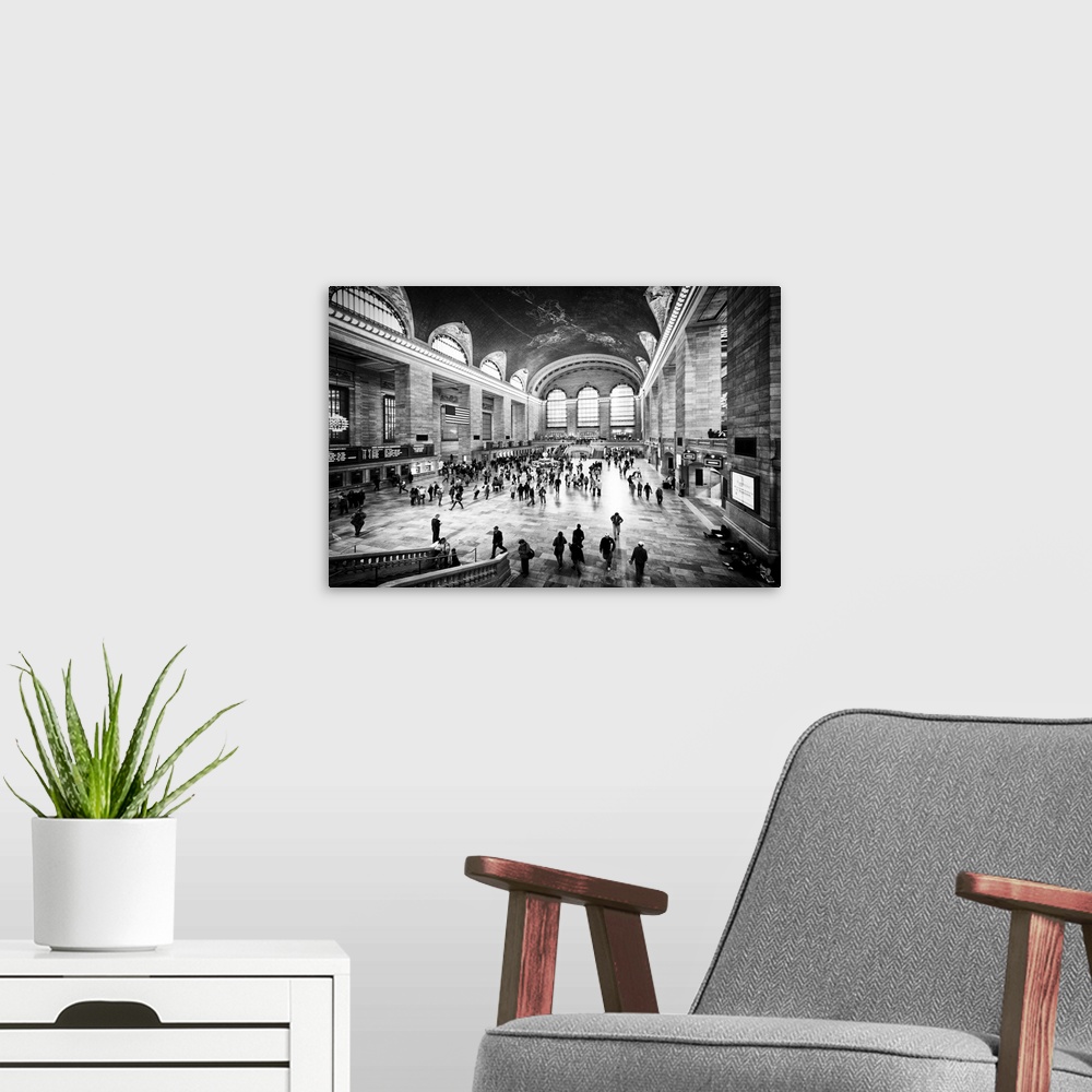 A modern room featuring A black and white photograph of the interior of Grand Central Station in New York City.