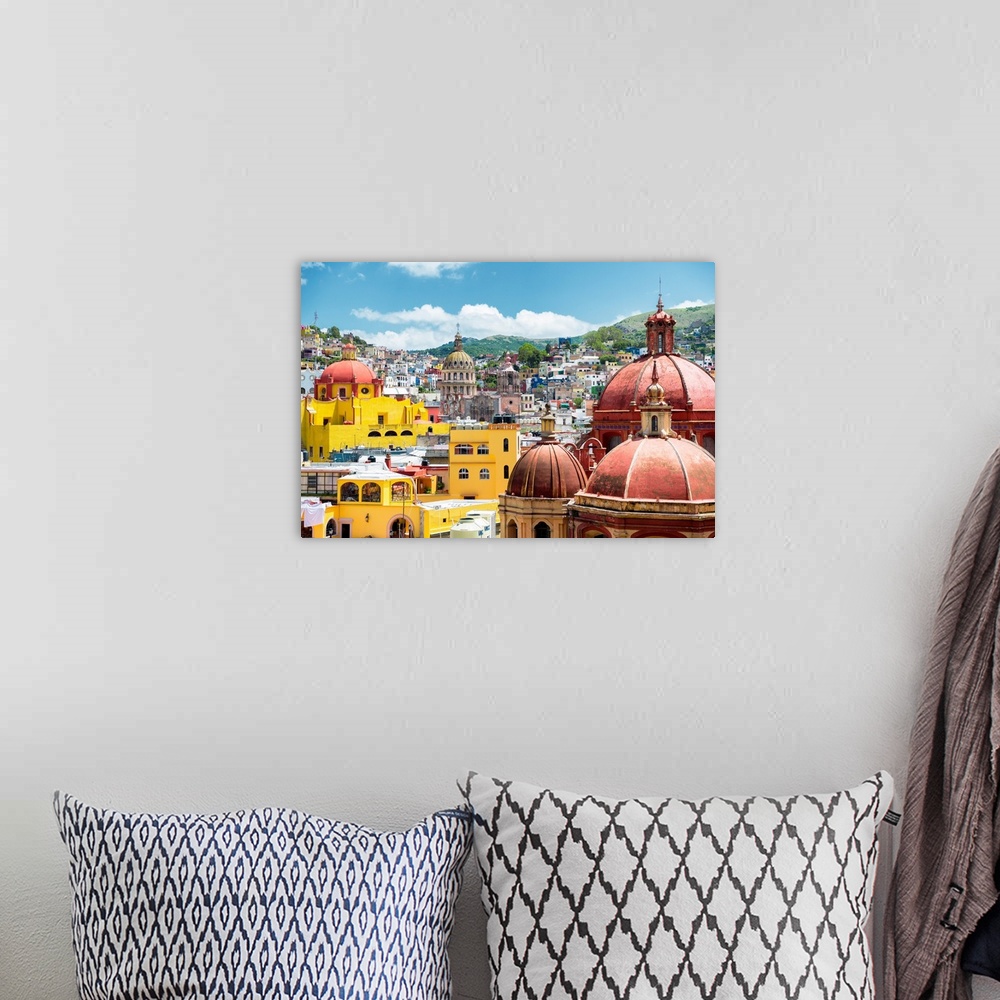A bohemian room featuring Photograph of a cityscape in Guanajuato, Mexico, highlighting the colorful buildings and church d...