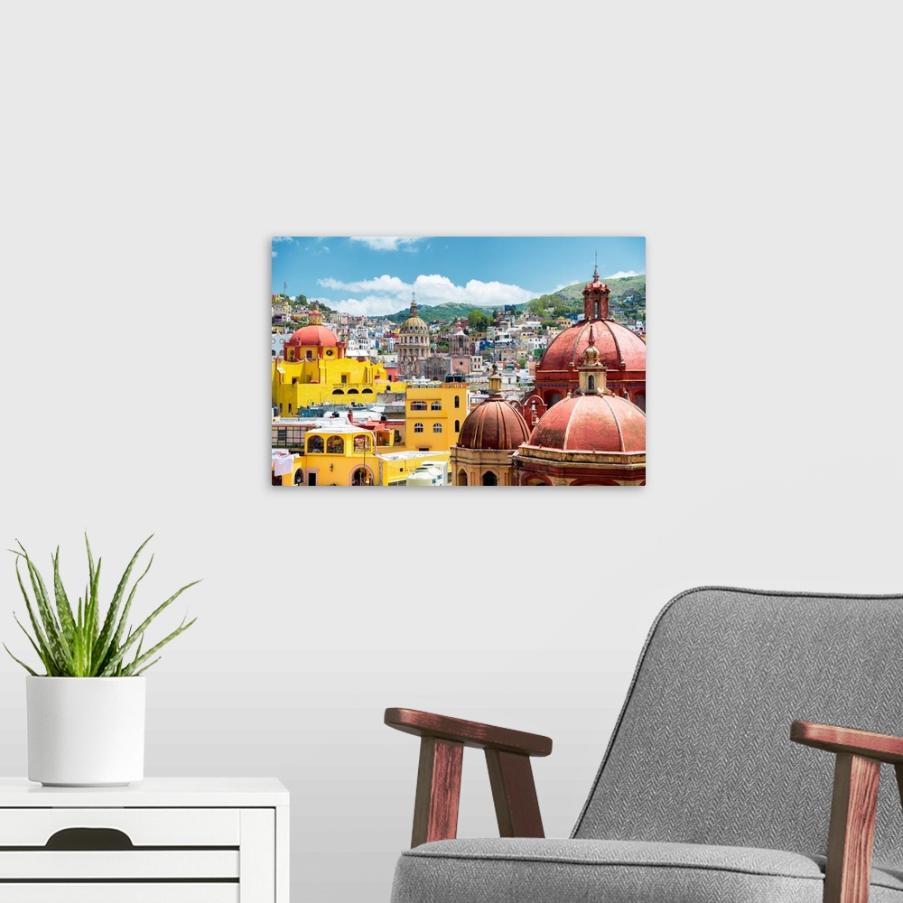 A modern room featuring Photograph of a cityscape in Guanajuato, Mexico, highlighting the colorful buildings and church d...