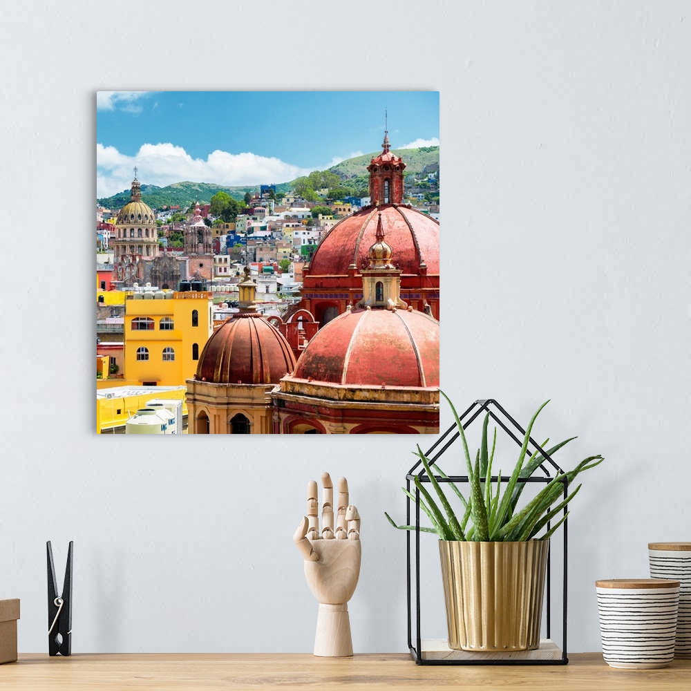 A bohemian room featuring Square photograph of a cityscape in Guanajuato, Mexico, highlighting the colorful buildings and c...