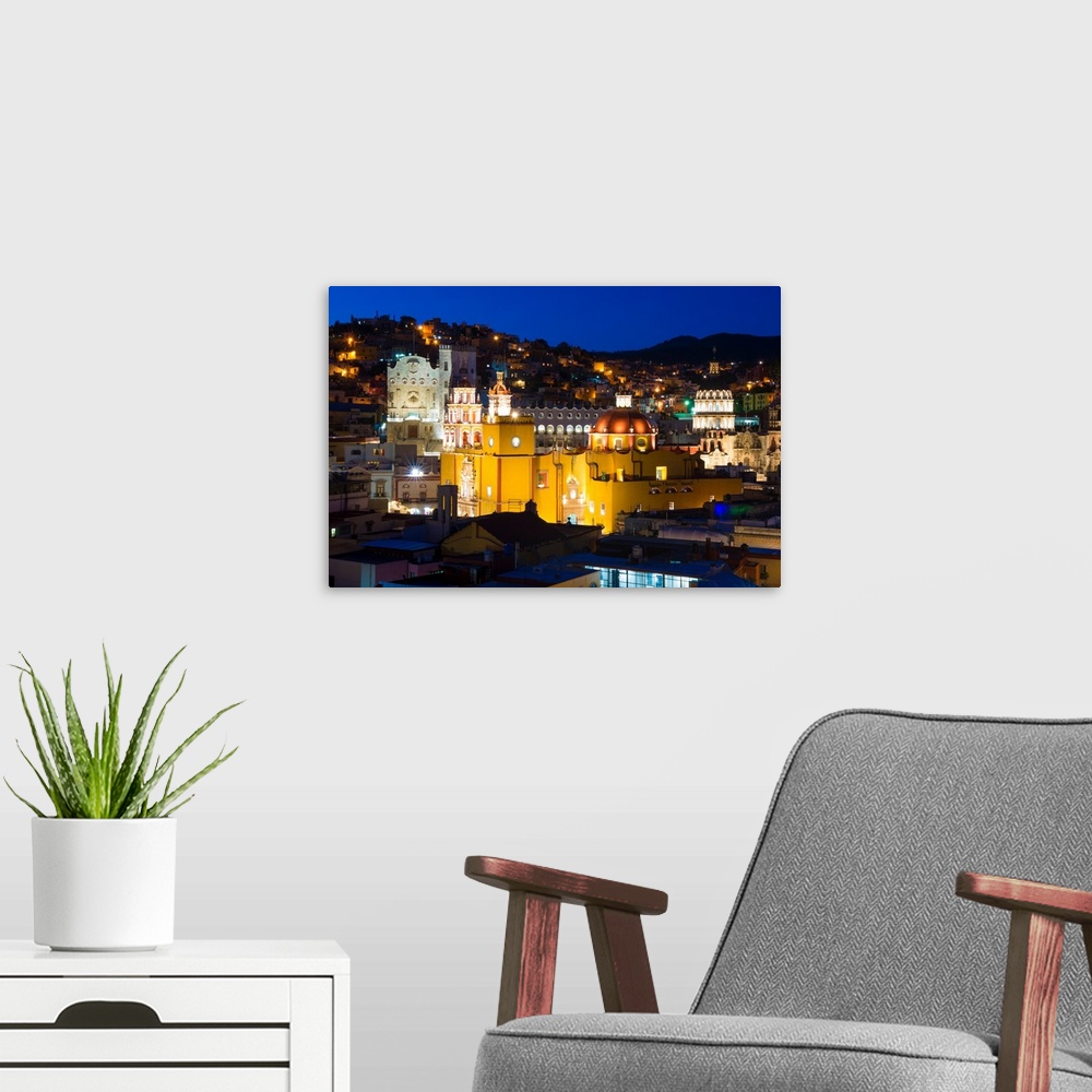 A modern room featuring Nighttime photograph of the iconic Yellow Church, Church of San Diego, in Guanajuato, Mexico. Fro...