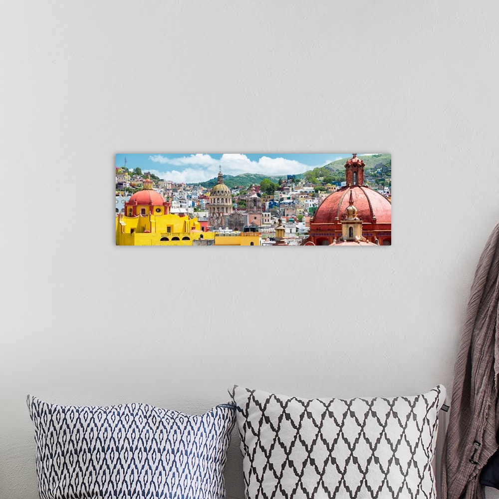A bohemian room featuring Panoramic photograph of a cityscape in Guanajuato, Mexico, with colorful buildings and church dom...