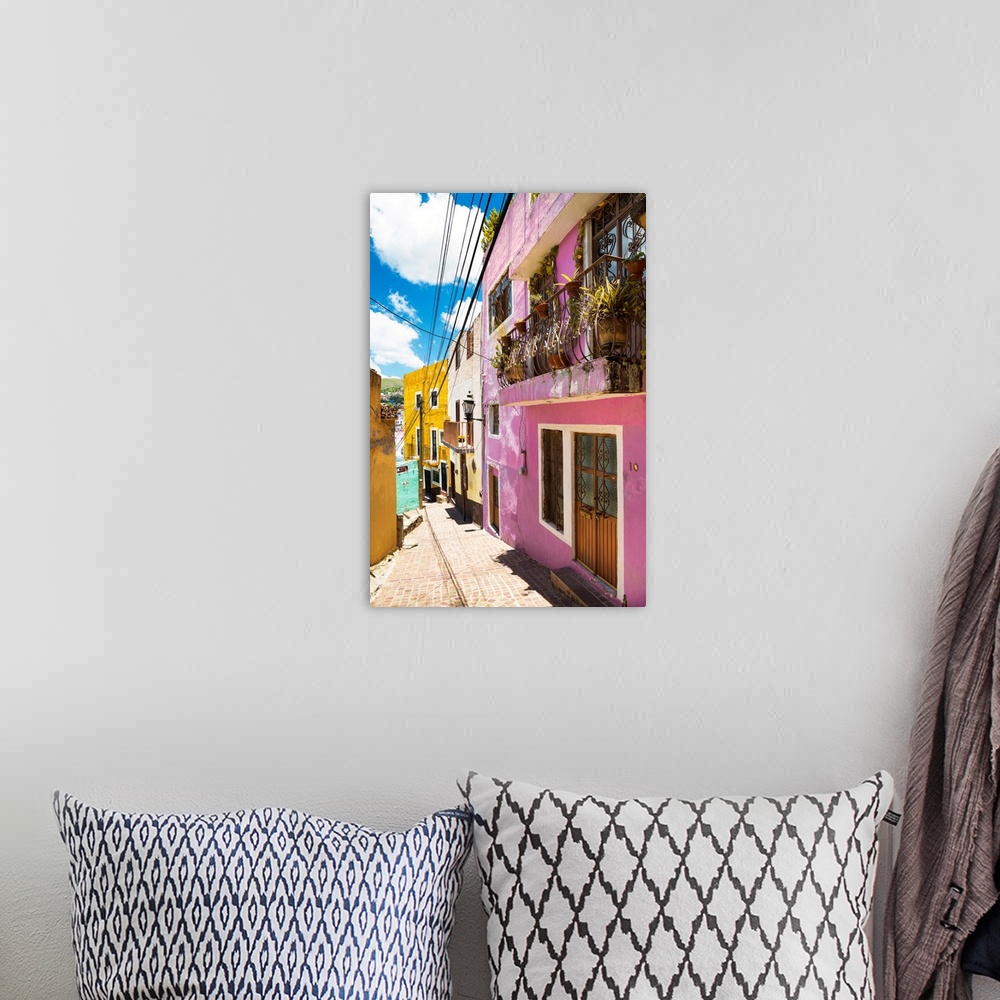 A bohemian room featuring Vertical photograph of a colorful streetscape in Guanajuato. From the Viva Mexico Collection.