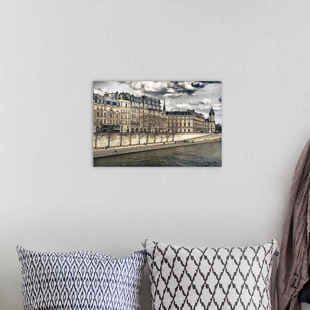 A bohemian room featuring Fine art photo of the buildings in the heart of Paris, surrounded by the Seine river.