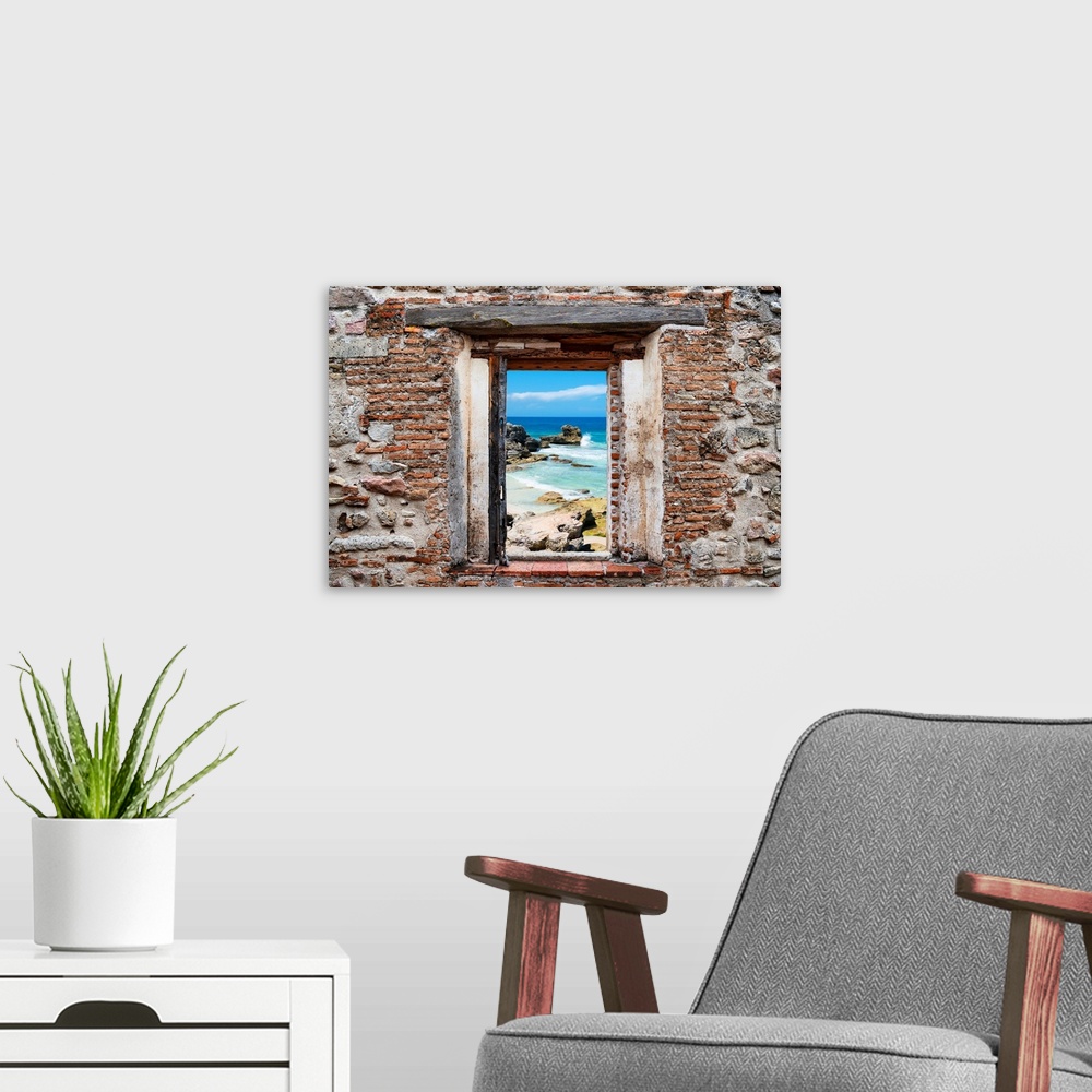 A modern room featuring View of the Isla Mujeres coastline framed through a stony, brick window. From the Viva Mexico Win...