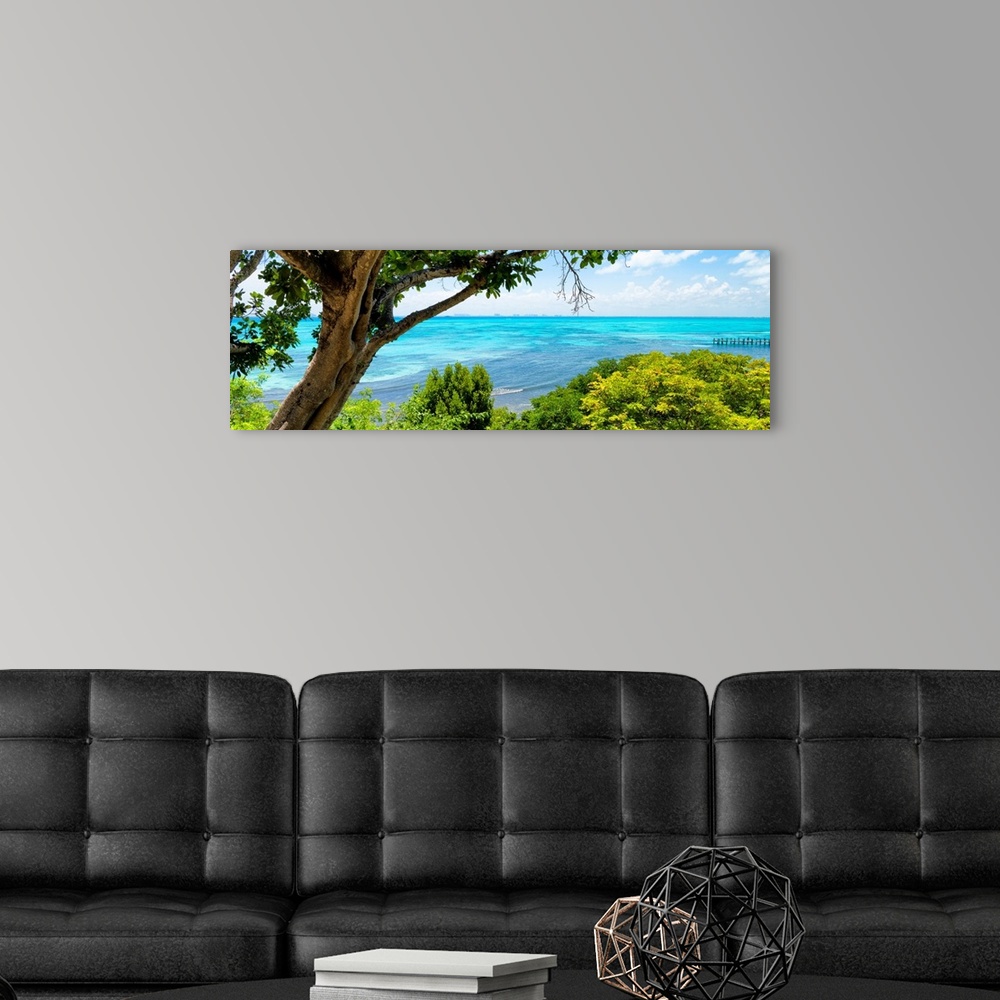 A modern room featuring Panoramic photograph of the beautiful, clear blue coastline at Isla Mujeres with the Cancun skyli...