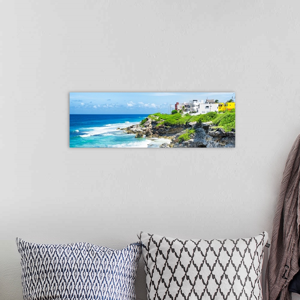 A bohemian room featuring Panoramic photograph of the Isla Mujeres coastline displaying a rocky shore and buildings in the ...