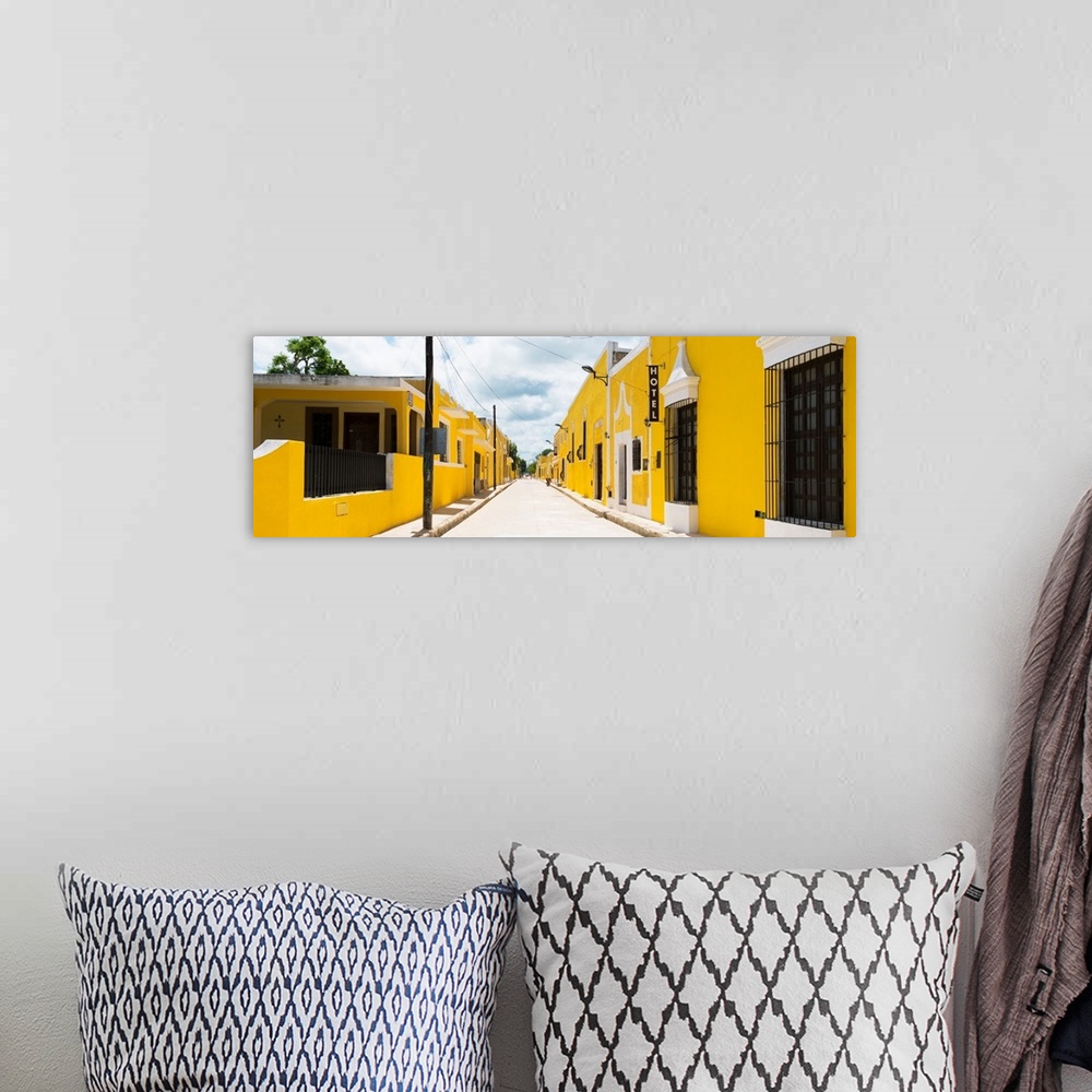 A bohemian room featuring Panoramic photograph of a bright streetcape in the Yellow City, Izamal, Mexico. From the Viva Mex...