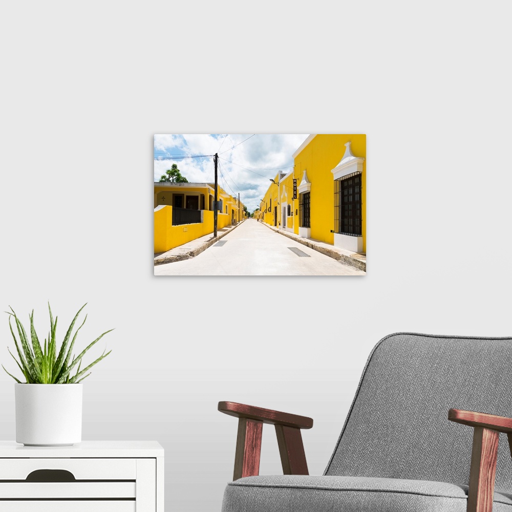 A modern room featuring Street view photograph highlighting the yellow buildings in Izamal, Yucat?n, Mexico. From the Viv...