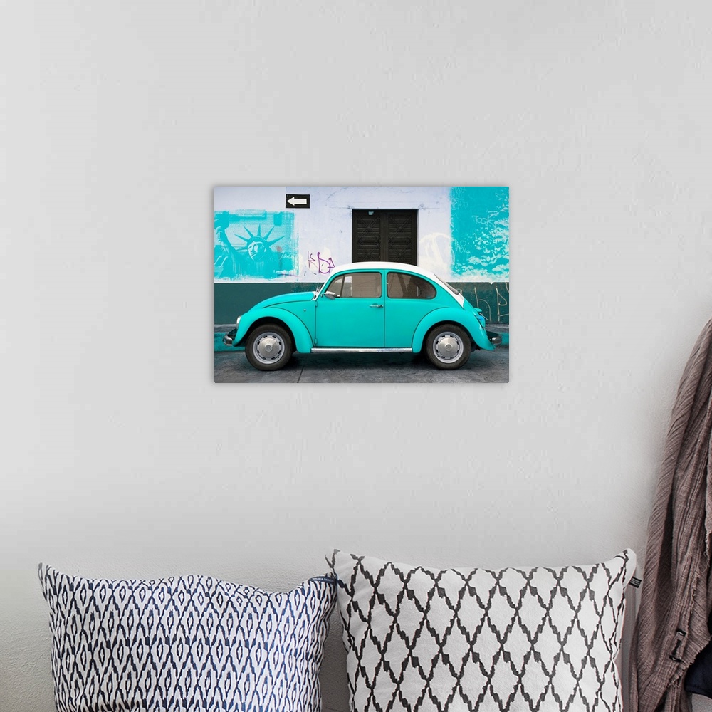A bohemian room featuring Photograph of a pink Volkswagen Beetle parked in front of a wall covered in light blue American g...