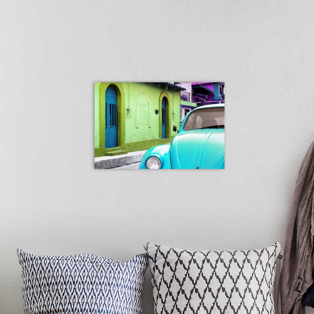 A bohemian room featuring Close-up photograph of a light blue Volkswagen Beetle parked next to colorful houses. From the Vi...