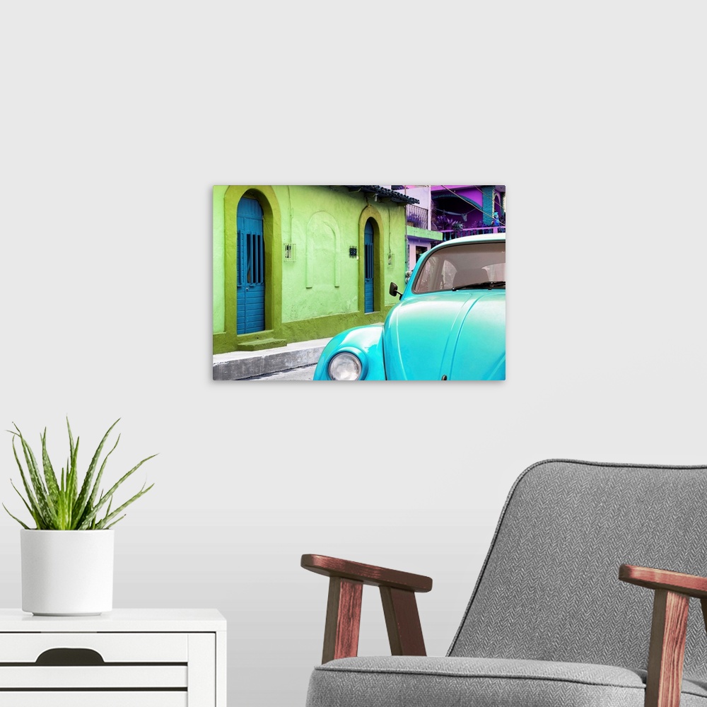 A modern room featuring Close-up photograph of a light blue Volkswagen Beetle parked next to colorful houses. From the Vi...