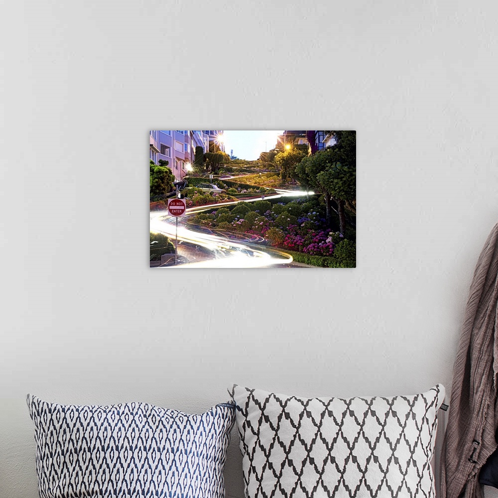 A bohemian room featuring Time lapse photo of light trails illuminates the switchbacks on Lombard Street.