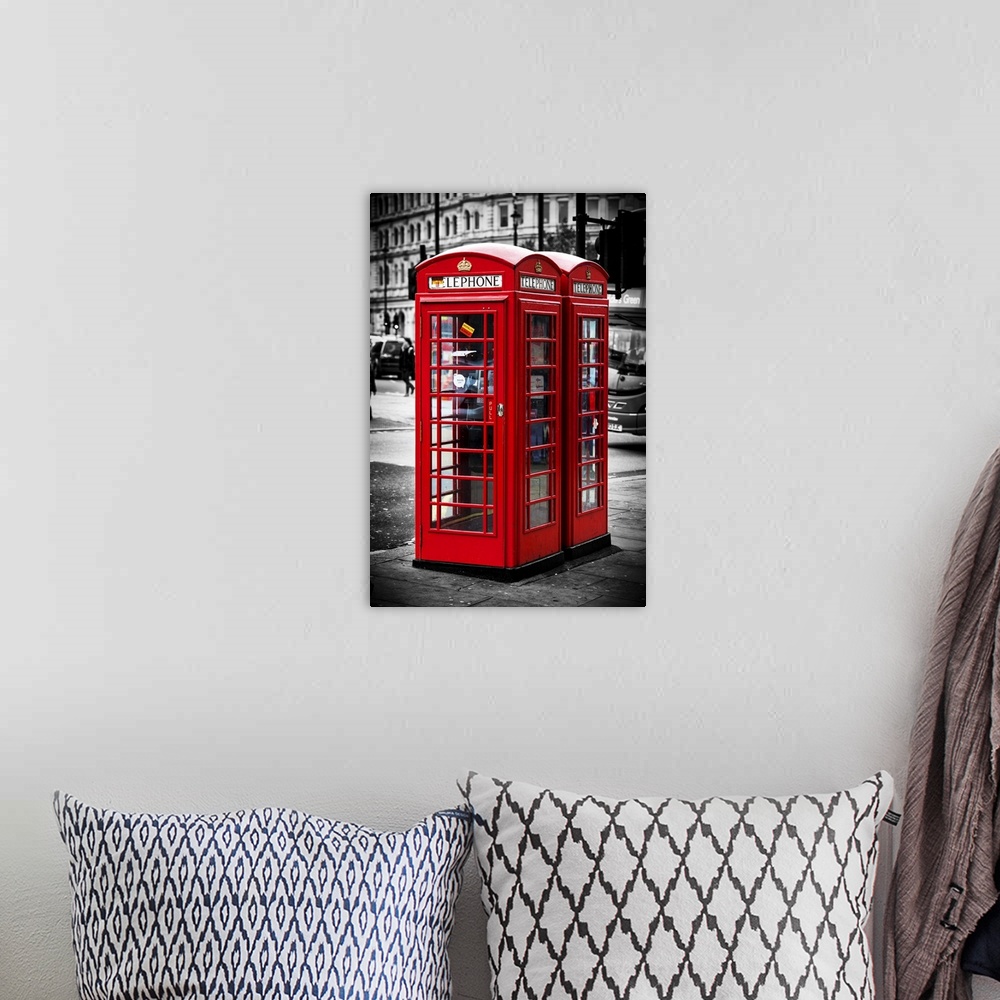 A bohemian room featuring Fine art photo of a red Telephone Booth in London, England, with selective coloring.