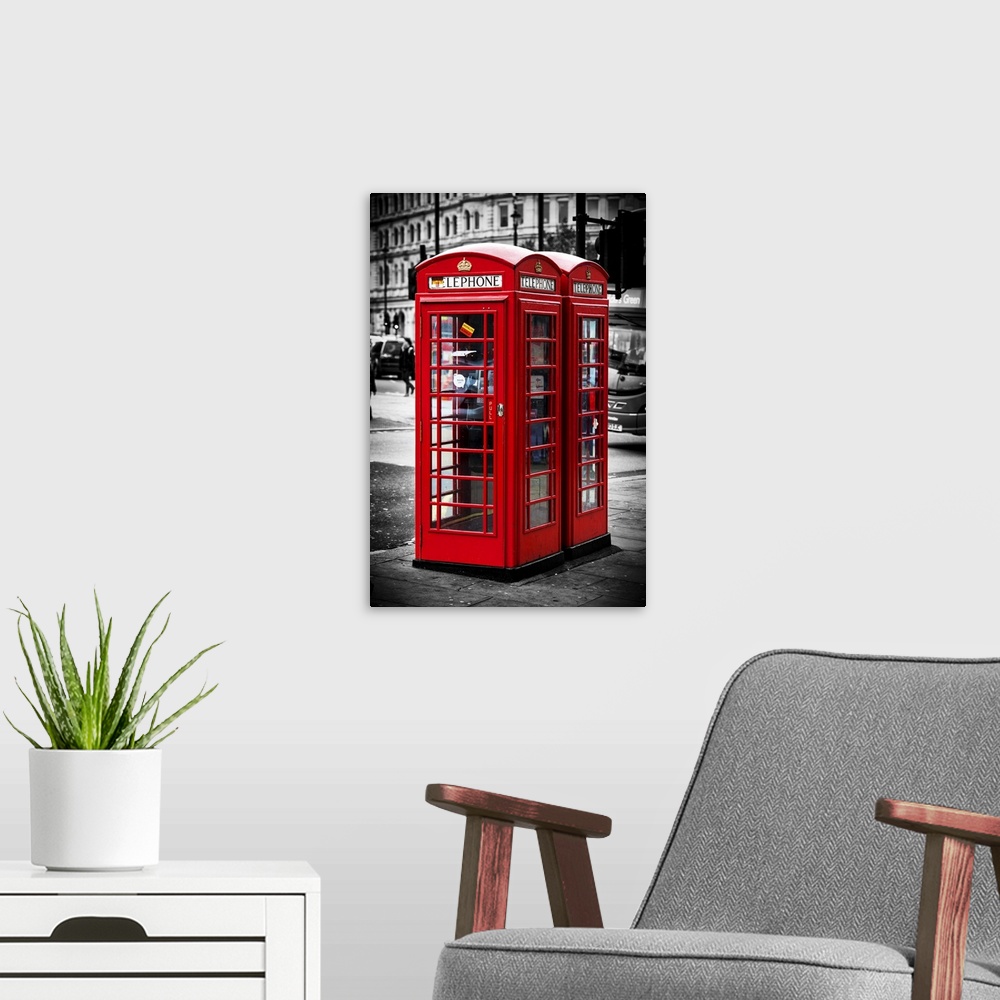 A modern room featuring Fine art photo of a red Telephone Booth in London, England, with selective coloring.