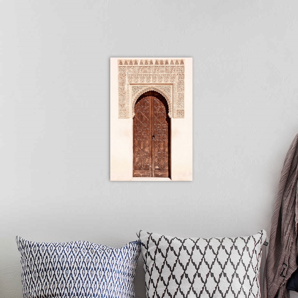 A bohemian room featuring It's a wooden door with arabic designed arch in the Alhambra, Granada, Spain.