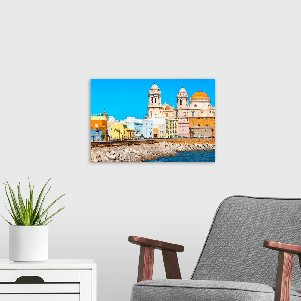 A modern room featuring It's the seaside on the city of Cadiz in Spain, with its colorful architecture.