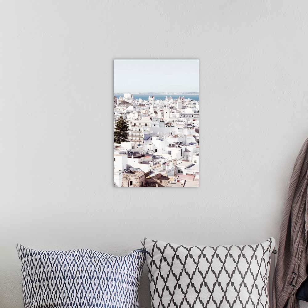 A bohemian room featuring It's a view of the beautiful white city of Cadiz in Spain.