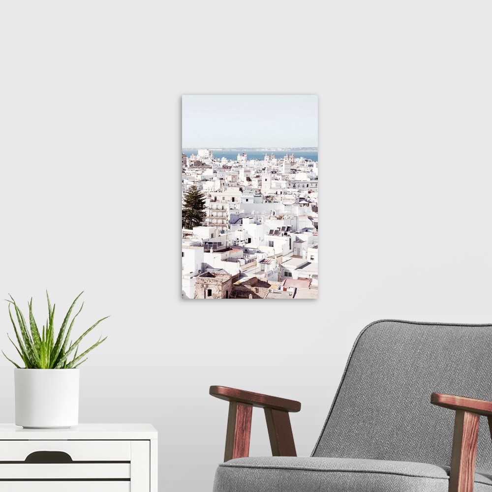 A modern room featuring It's a view of the beautiful white city of Cadiz in Spain.