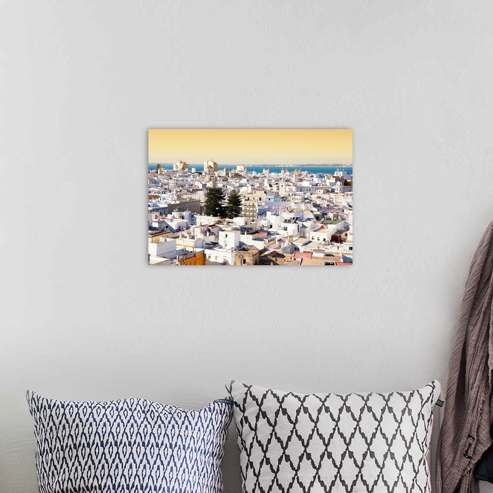 A bohemian room featuring It's a view of the beautiful city of Cadiz in Spain at sunset.
