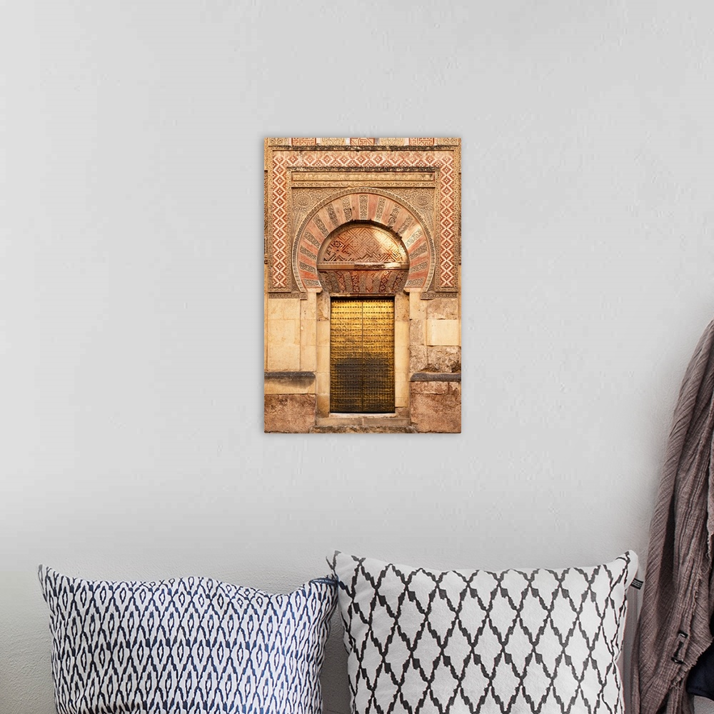 A bohemian room featuring It's a golden door of the famous Mosque-Cathedral of Cordoba in Spain.