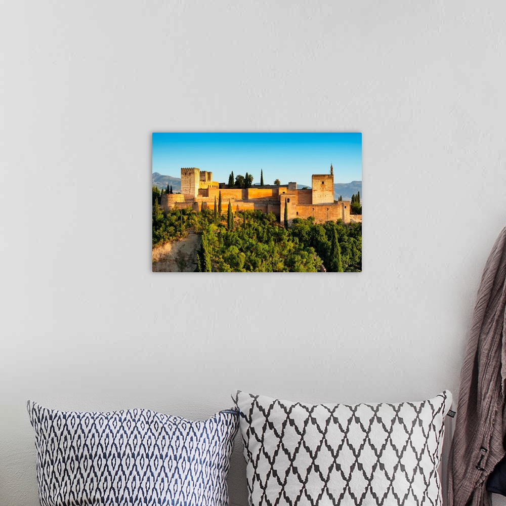 A bohemian room featuring It's a view of the Alhambra of Granada in Andalusia at sunset (Spain).